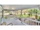 Inviting front porch with a swing and view of the well-manicured yard at 1550 Indiana Ave, Winter Park, FL 32789