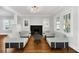 Cozy living room with hardwood floors, fireplace, and comfortable seating at 1550 Indiana Ave, Winter Park, FL 32789