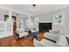 Spacious living room with hardwood floors, fireplace and comfortable seating at 1550 Indiana Ave, Winter Park, FL 32789