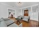 Light-filled living room with hardwood floors, fireplace and comfortable seating at 1550 Indiana Ave, Winter Park, FL 32789