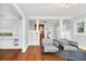 Bright living room with hardwood floors, built-in shelving, and fireplace at 1550 Indiana Ave, Winter Park, FL 32789