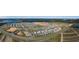 An aerial view of a neighborhood with houses, roads, and a nearby lake at 2075 Heart Lake Dr, Groveland, FL 34736