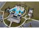 Elevated view of the community pool area with a playground and clubhouse at 2075 Heart Lake Dr, Groveland, FL 34736