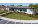 Modern clubhouse with stone accents, large windows, and landscaping at 2075 Heart Lake Dr, Groveland, FL 34736