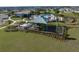 Playground with a canopy, slides, and lush green grass at 2075 Heart Lake Dr, Groveland, FL 34736