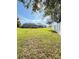 Spacious backyard with lush lawn and home view at 2464 Deer Creek Blvd, St Cloud, FL 34772