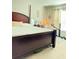 Main bedroom with a large bed, dresser, and window coverings at 2464 Deer Creek Blvd, St Cloud, FL 34772