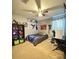 Small bedroom with a single bed and a workspace at 2464 Deer Creek Blvd, St Cloud, FL 34772