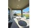 Relaxing screened porch with patio furniture and view of backyard at 2464 Deer Creek Blvd, St Cloud, FL 34772