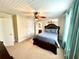 Spacious bedroom with a queen-size bed and ensuite bathroom at 2904 S Peninsula Dr, Daytona Beach Shores, FL 32118