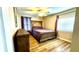 Cozy bedroom with wood flooring and a comfortable queen-size bed at 2904 S Peninsula Dr, Daytona Beach Shores, FL 32118