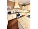 Well-equipped kitchen with granite countertops and modern appliances at 2904 S Peninsula Dr, Daytona Beach Shores, FL 32118