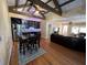 Open-concept living area with exposed beams, kitchen, and dining area at 2904 S Peninsula Dr, Daytona Beach Shores, FL 32118