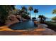Private pool with a rock waterfall feature at 2904 S Peninsula Dr, Daytona Beach Shores, FL 32118