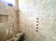 Large shower with multiple shower heads and a built-in granite seat at 2904 S Peninsula Dr, Daytona Beach Shores, FL 32118
