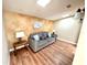 Relaxing sitting room with a gray sofa and wood-look flooring at 2904 S Peninsula Dr, Daytona Beach Shores, FL 32118