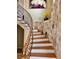 Stunning curved staircase with stone feature wall at 2904 S Peninsula Dr, Daytona Beach Shores, FL 32118