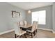 Dining room with a large table, upholstered chairs, and a decorative light fixture at 4937 Blanche Ct, Saint Cloud, FL 34772