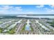 Aerial perspective of a waterfront community with numerous homes along canals and docks at 4937 Blanche Ct, Saint Cloud, FL 34772