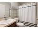 Clean and functional bathroom with a shower/tub combo and modern fixtures at 5761 Woodruff Way, Lakeland, FL 33812