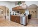 Kitchen with wood cabinets, stainless steel appliances, and granite countertops at 5761 Woodruff Way, Lakeland, FL 33812