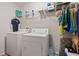 Convenient laundry room with washer, dryer, and ample storage space at 5761 Woodruff Way, Lakeland, FL 33812