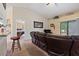 Living room with leather sectional sofa, ceiling fan, and view of the bedroom at 5761 Woodruff Way, Lakeland, FL 33812