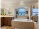 Spacious Primary bathroom with dual vanities, a soaking tub, and a separate shower at 5761 Woodruff Way, Lakeland, FL 33812