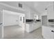 Modern kitchen with white cabinets, granite countertops, and herringbone backsplash at 6015 Walbridge St, Orlando, FL 32809