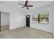 Living room with ceiling fan and entry to bedroom at 6015 Walbridge St, Orlando, FL 32809