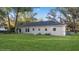 Large backyard with lush grass and mature trees at 632 Oakhurst St, Altamonte Springs, FL 32701