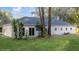 House boasts a spacious backyard, lush lawn, and mature trees at 632 Oakhurst St, Altamonte Springs, FL 32701