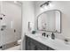 Modern bathroom with a walk-in shower, stylish vanity, and contemporary fixtures at 6535 Shimmering Shores Ln, St Cloud, FL 34771