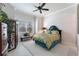 Bedroom with ceiling fan, decorative bedding and furnishings, and lots of natural light at 6535 Shimmering Shores Ln, St Cloud, FL 34771