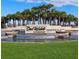 Elegant community entrance with water features and lush landscaping at 6535 Shimmering Shores Ln, St Cloud, FL 34771