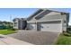 Welcoming home exterior with a large driveway and front lawn at 6535 Shimmering Shores Ln, St Cloud, FL 34771