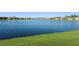 Community lake with waterfront homes and green landscaping at 6535 Shimmering Shores Ln, St Cloud, FL 34771