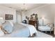 Elegant main bedroom with large bed, stylish furniture, and a relaxing atmosphere at 6535 Shimmering Shores Ln, St Cloud, FL 34771