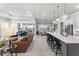 Open floorplan with a spacious kitchen, dining area, and living room with sliding glass doors to the outside at 6535 Shimmering Shores Ln, St Cloud, FL 34771
