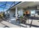 Spacious covered patio with outdoor kitchen and seating area at 6535 Shimmering Shores Ln, St Cloud, FL 34771