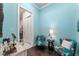 Vanity area with floral chairs and a small table adjacent to the bathroom at 6535 Shimmering Shores Ln, St Cloud, FL 34771