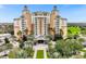 View of a grand resort-style building with lush landscaping at 7632 Excitement Dr, Reunion, FL 34747