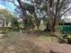 Large backyard with trees and storage shed at 826 Rosalia Dr, Sanford, FL 32771