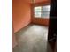 An empty bedroom with a window and a door at 826 Rosalia Dr, Sanford, FL 32771