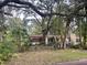 Front exterior of the home with landscaping and trees at 826 Rosalia Dr, Sanford, FL 32771