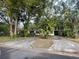 Front exterior view of a home with a driveway, landscaping, and trees at 826 Rosalia Dr, Sanford, FL 32771