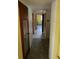 Long hallway with doors leading to various rooms at 826 Rosalia Dr, Sanford, FL 32771
