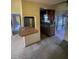 View of the kitchen area with cabinets, countertops, and a pass-through window at 826 Rosalia Dr, Sanford, FL 32771