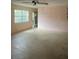 Empty living room with a ceiling fan, window, and door at 826 Rosalia Dr, Sanford, FL 32771