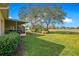 Backyard view with screened porch and golf course views at 111 Bell Tower E Xing, Poinciana, FL 34759